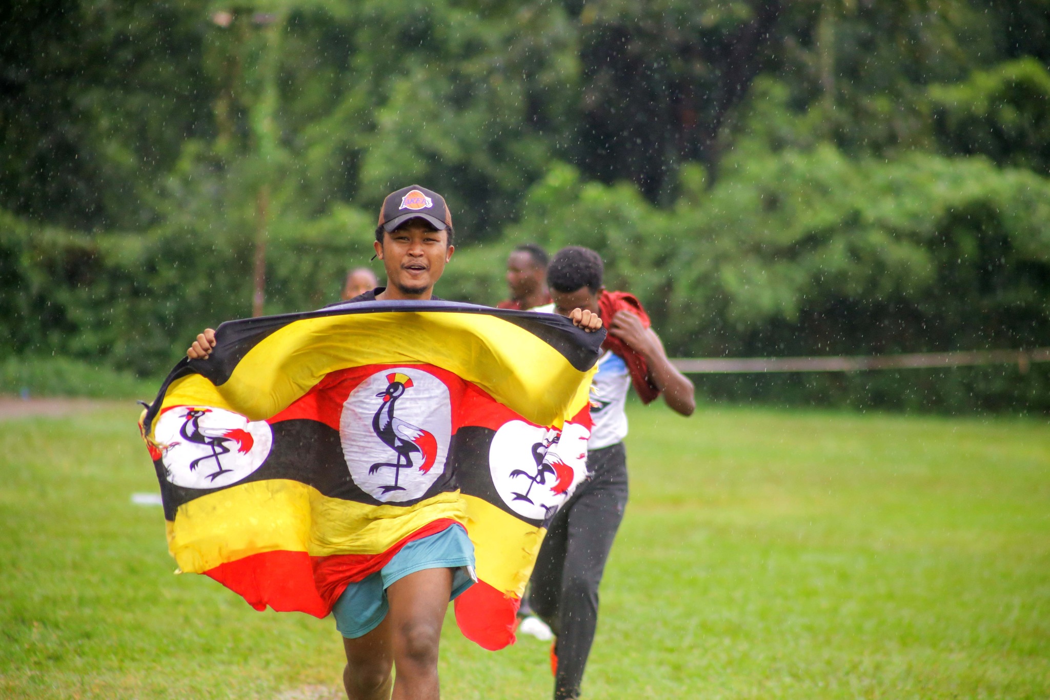 A participant carrying the Uganda flag