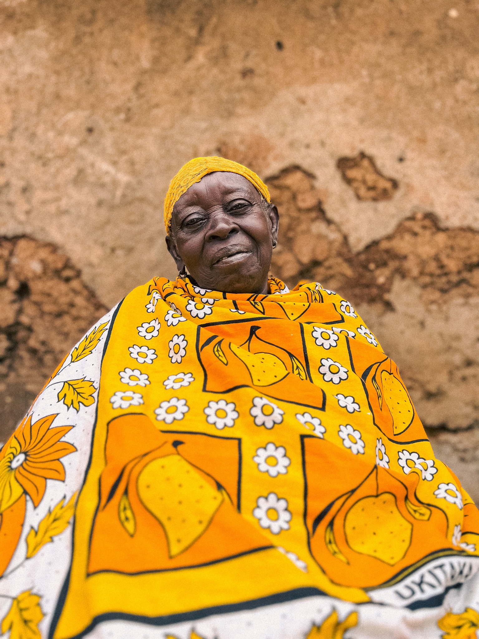 Woman wearing yellow in Uganda